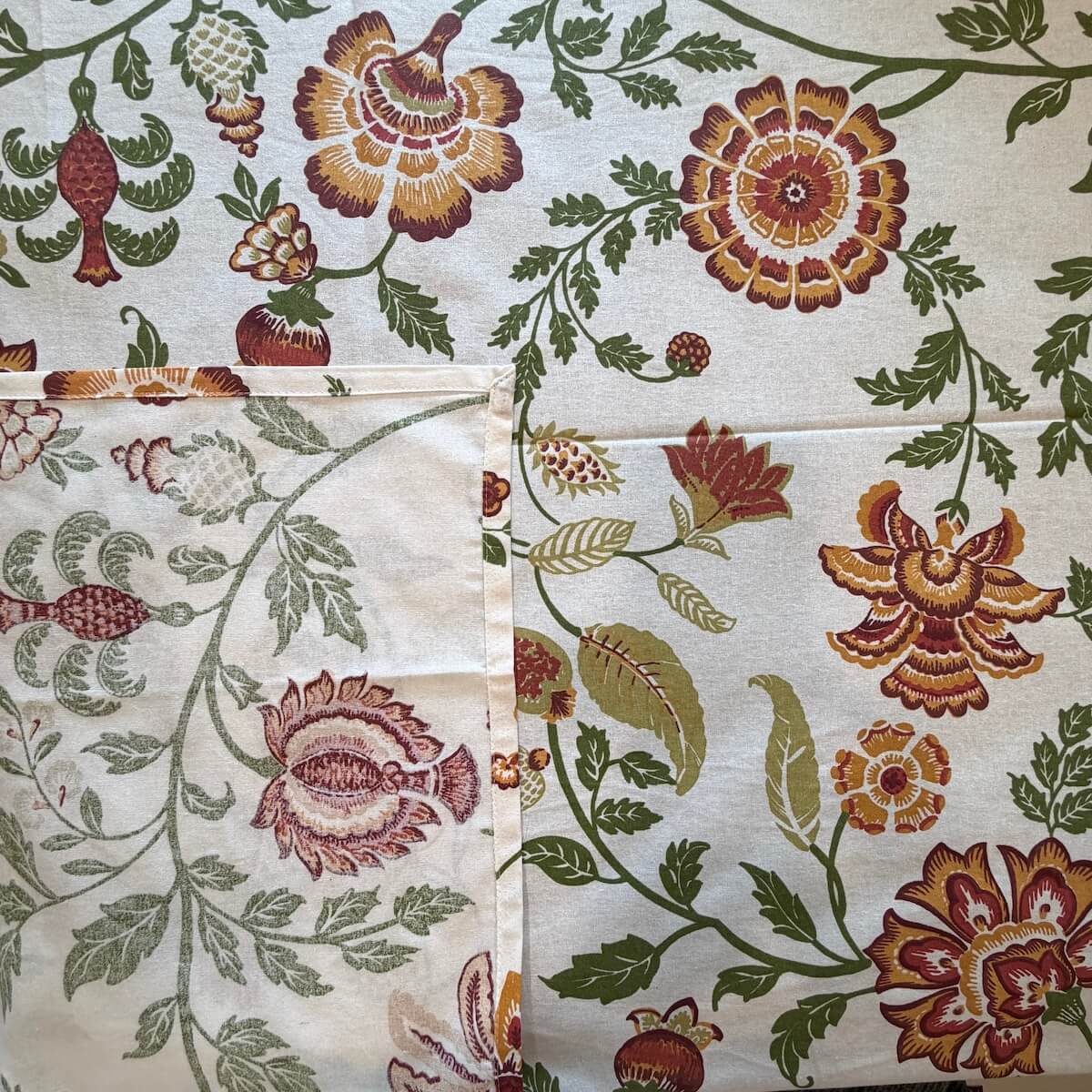 Close up of white Jaipur floral hand block print pattern on 100% cotton bed sheet
