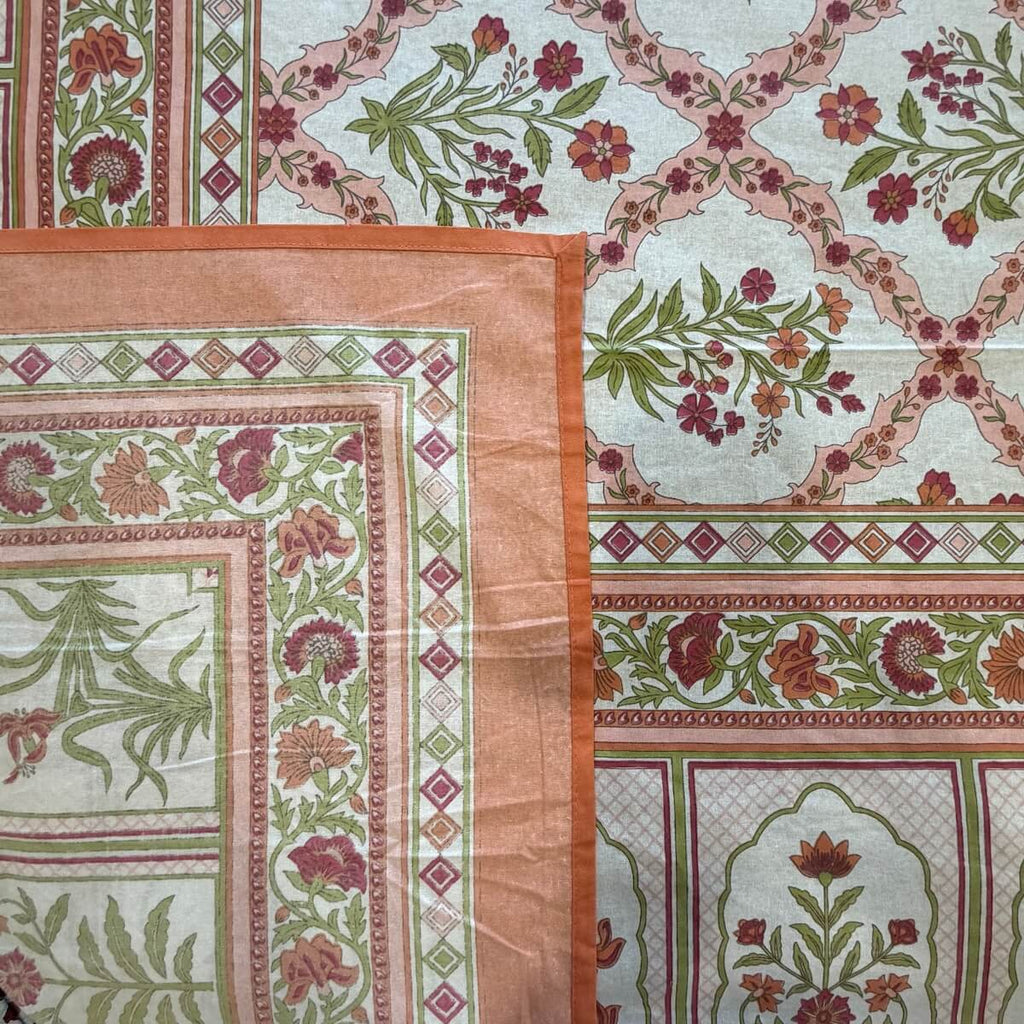 Close up of coral white Jaipur jaal floral hand block print pattern on 100% cotton bed sheet