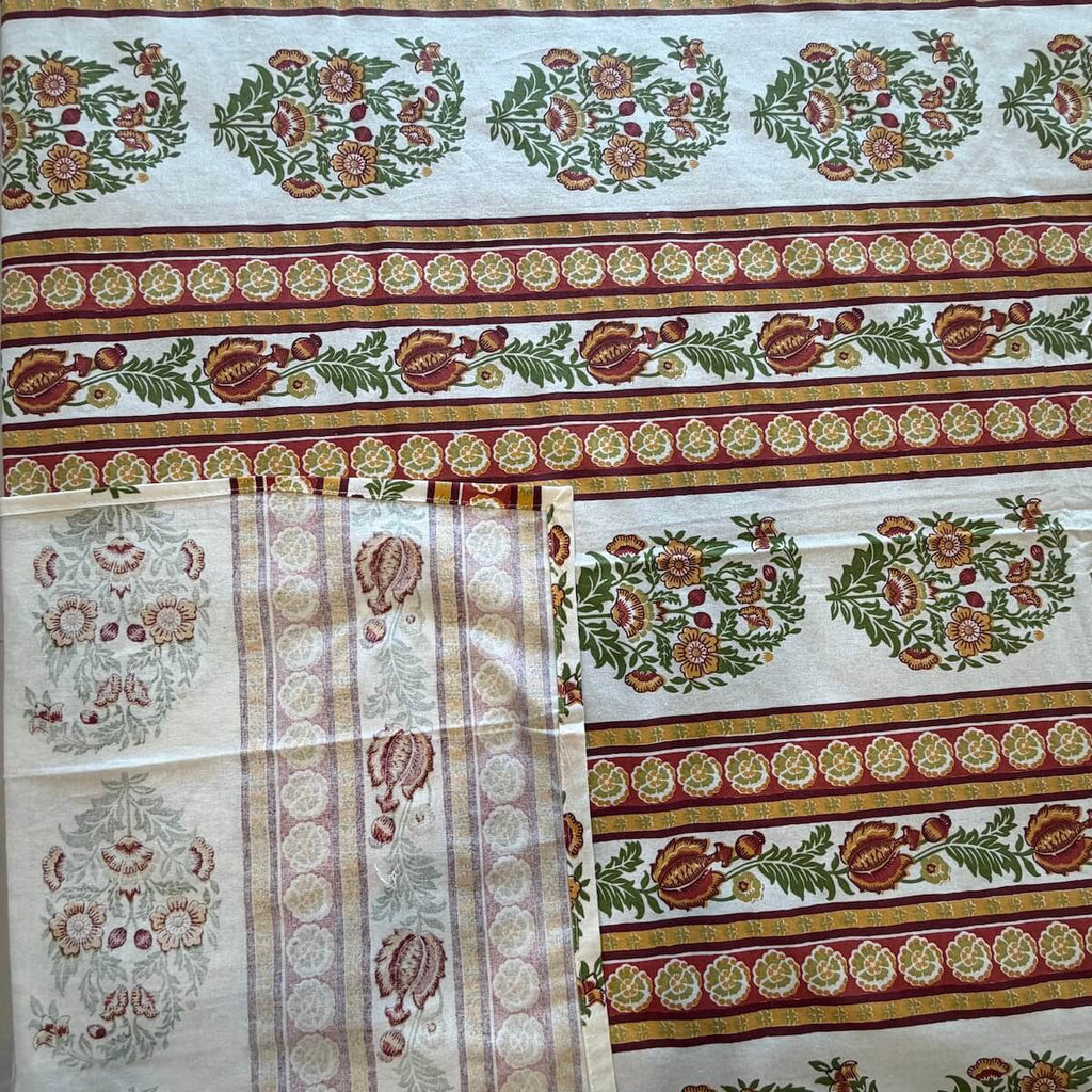 Close up of white Jaipur stripe boota hand block print pattern on 100% cotton bed sheet