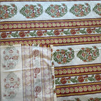 Close up of white Jaipur stripe boota hand block print pattern on 100% cotton bed sheet