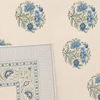 Close up of cream blue Jaipur medallion floral hand block print pattern on 100% cotton bed sheet