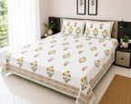 White yellow marigold Jaipur block printed cotton king size bed sheet set styled on bed 90x108 inch