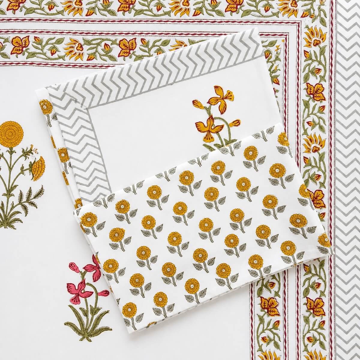 Hand block printed white yellow marigold floral cotton king size bed sheet folded 90x108 inch