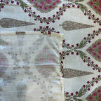 Close up of off white pink Jaipur diamond jaal hand block print pattern on 100% cotton bed sheet
